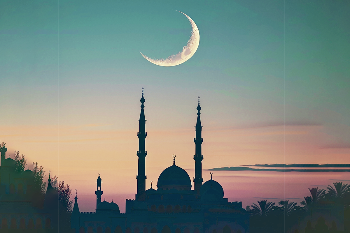 Crescent moon above a mosque at dawn representing waking up for Fajr prayer consistently in Islam